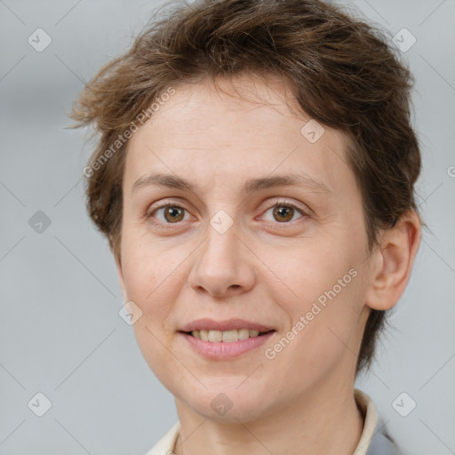 Joyful white adult female with short  brown hair and brown eyes