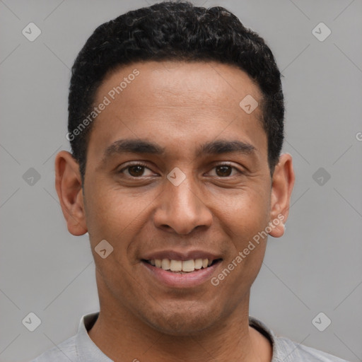 Joyful latino young-adult male with short  black hair and brown eyes