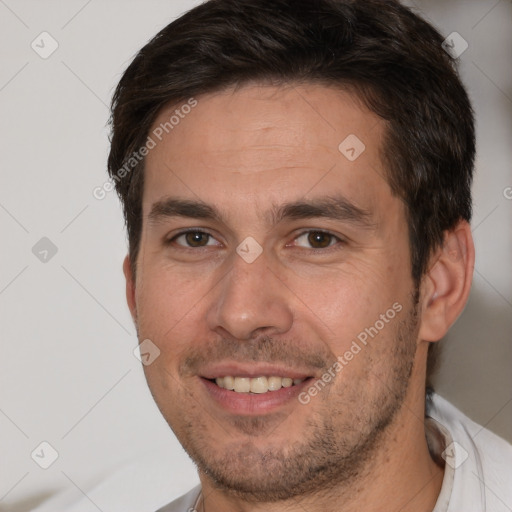 Joyful white adult male with short  brown hair and brown eyes