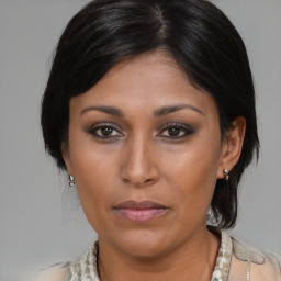 Neutral asian young-adult female with medium  brown hair and brown eyes