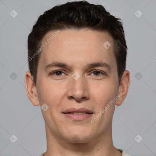 Joyful white adult male with short  brown hair and brown eyes