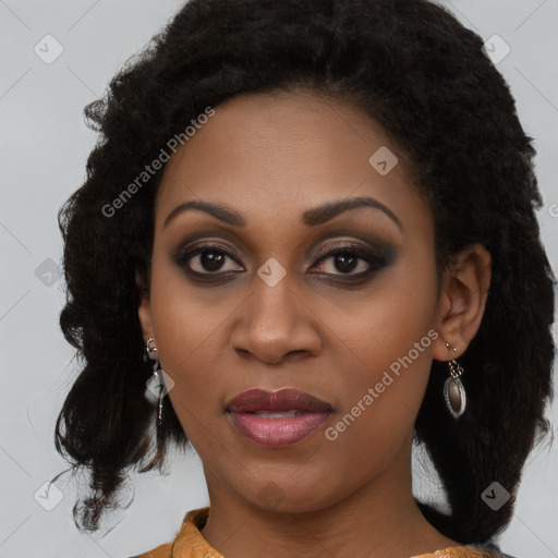 Joyful black young-adult female with medium  brown hair and brown eyes