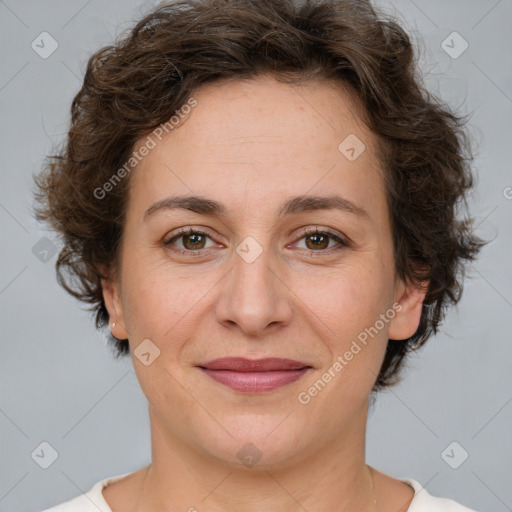 Joyful white adult female with short  brown hair and brown eyes