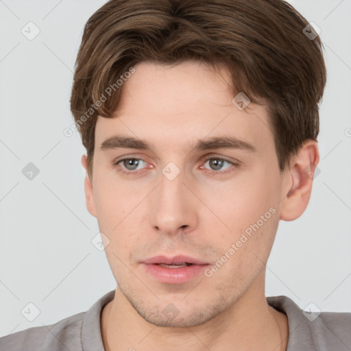 Neutral white young-adult male with short  brown hair and brown eyes