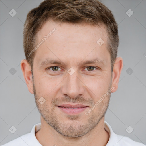 Joyful white adult male with short  brown hair and brown eyes