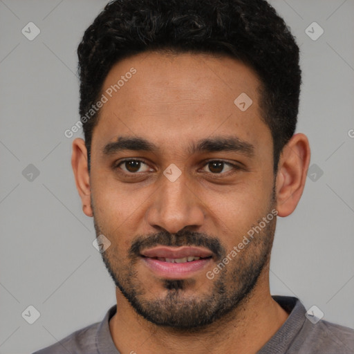 Joyful latino young-adult male with short  black hair and brown eyes