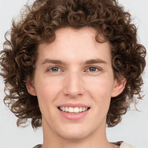 Joyful white young-adult female with medium  brown hair and green eyes