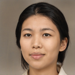 Joyful asian young-adult female with medium  black hair and brown eyes