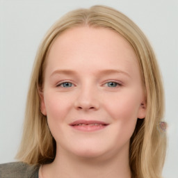 Joyful white young-adult female with long  brown hair and blue eyes