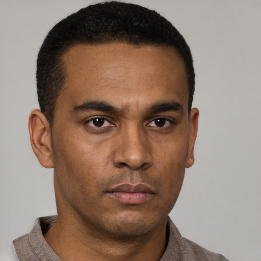 Neutral latino young-adult male with short  brown hair and brown eyes