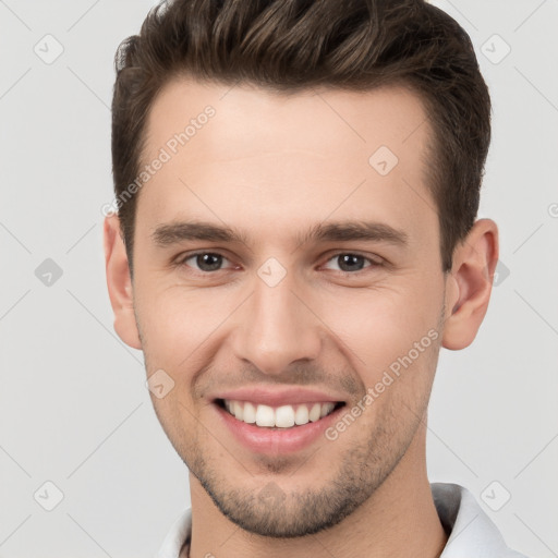 Joyful white young-adult male with short  brown hair and brown eyes