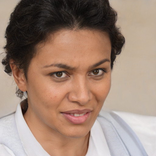 Joyful white adult female with short  brown hair and brown eyes