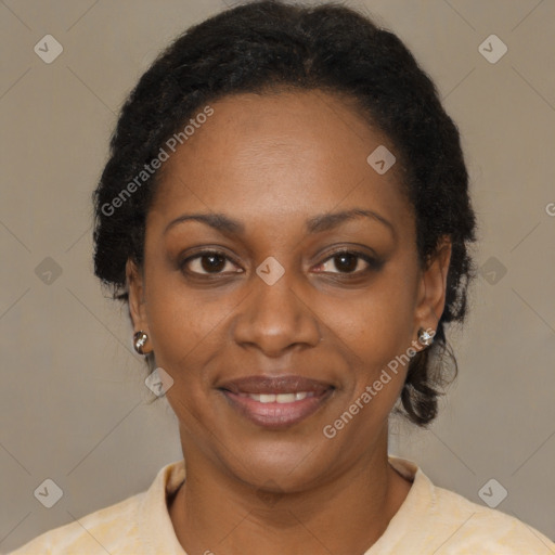 Joyful black adult female with short  brown hair and brown eyes