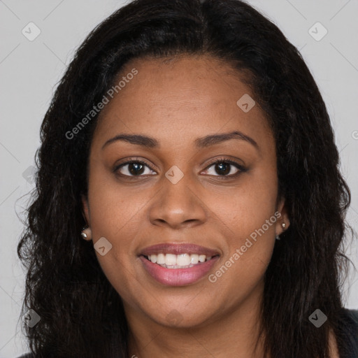 Joyful black young-adult female with long  brown hair and brown eyes