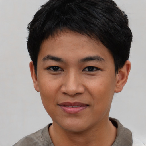 Joyful asian young-adult female with short  black hair and brown eyes