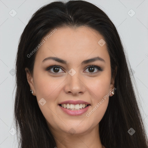 Joyful latino young-adult female with long  brown hair and brown eyes