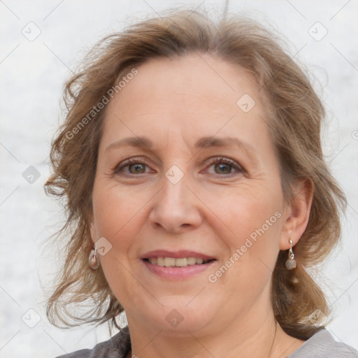 Joyful white adult female with medium  brown hair and grey eyes