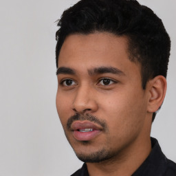 Neutral latino young-adult male with short  black hair and brown eyes
