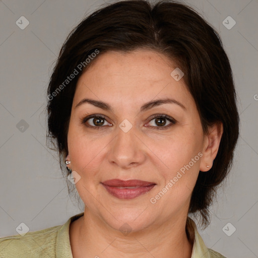 Joyful white adult female with medium  brown hair and brown eyes