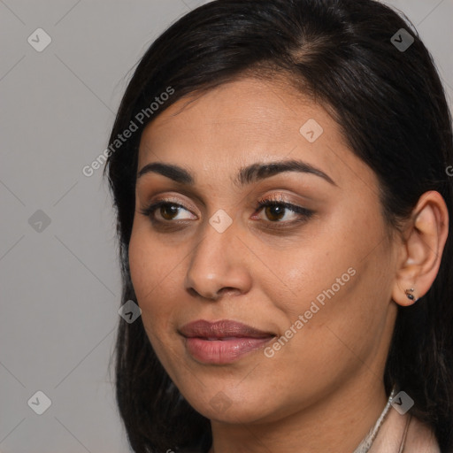 Joyful latino young-adult female with long  brown hair and brown eyes