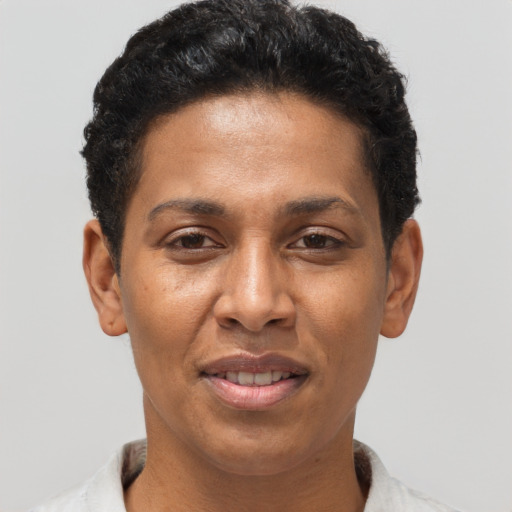 Joyful black adult female with short  brown hair and brown eyes