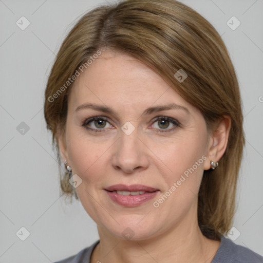 Joyful white adult female with medium  brown hair and grey eyes