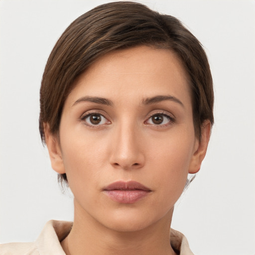 Neutral white young-adult female with short  brown hair and brown eyes