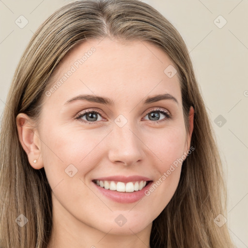 Joyful white young-adult female with long  brown hair and blue eyes