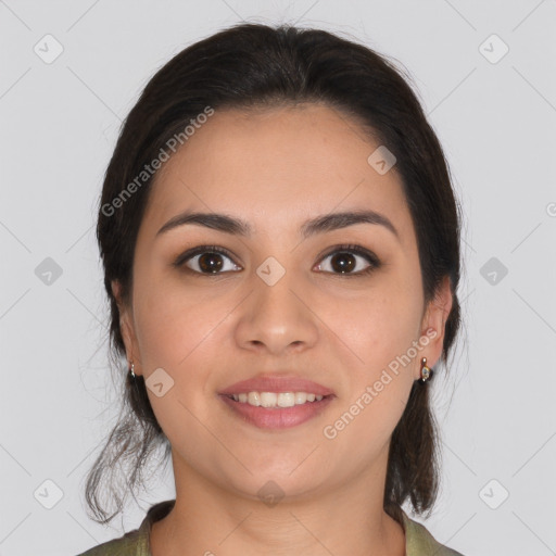 Joyful latino young-adult female with medium  brown hair and brown eyes