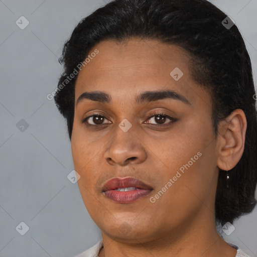 Joyful black young-adult female with short  black hair and brown eyes