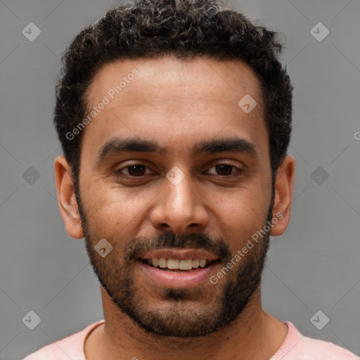 Joyful white young-adult male with short  black hair and brown eyes