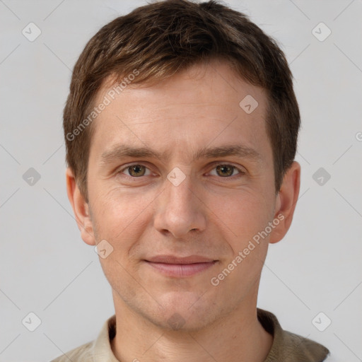 Joyful white adult male with short  brown hair and brown eyes