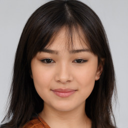 Joyful asian young-adult female with long  brown hair and brown eyes