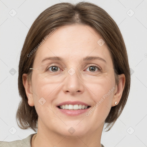 Joyful white adult female with medium  brown hair and grey eyes