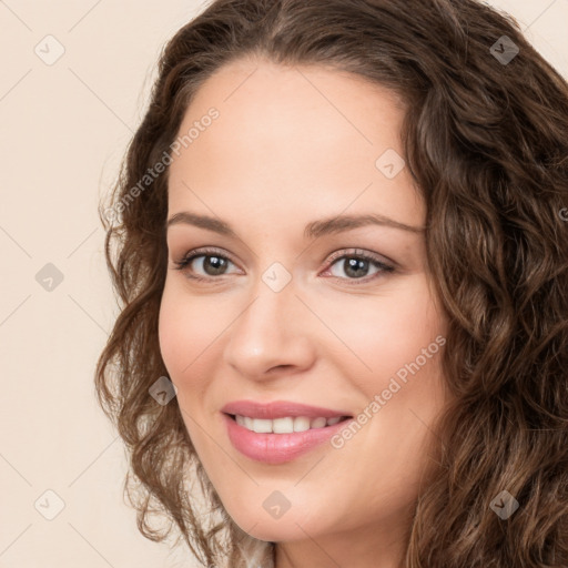 Joyful white young-adult female with long  brown hair and green eyes