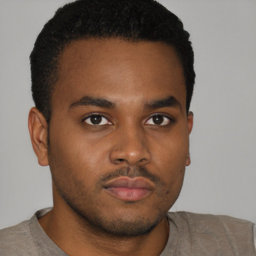 Neutral black young-adult male with short  brown hair and brown eyes