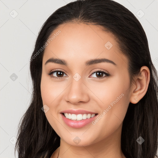 Joyful white young-adult female with long  brown hair and brown eyes