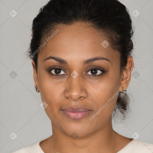 Joyful black young-adult female with short  brown hair and brown eyes