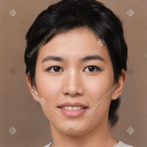 Joyful asian young-adult female with medium  black hair and brown eyes