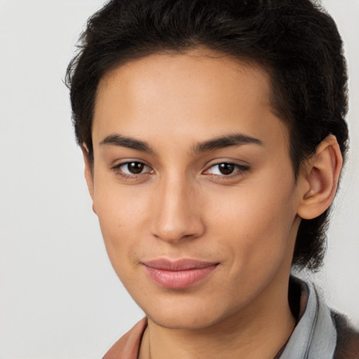 Joyful latino young-adult female with short  brown hair and brown eyes