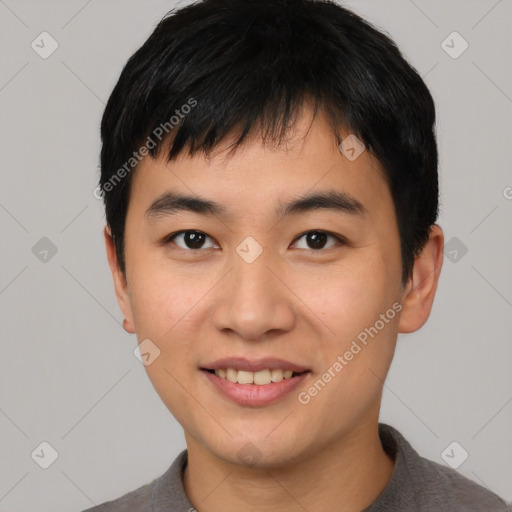 Joyful asian young-adult male with short  black hair and brown eyes