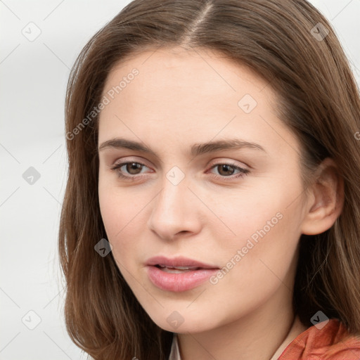 Neutral white young-adult female with long  brown hair and brown eyes