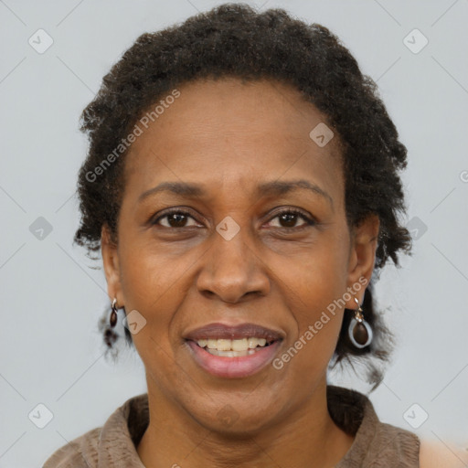 Joyful black adult female with short  brown hair and brown eyes