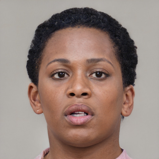 Neutral black young-adult female with short  brown hair and brown eyes
