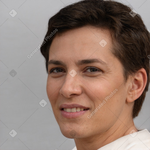 Joyful white adult female with short  brown hair and brown eyes