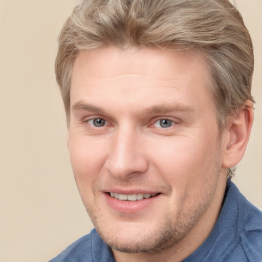 Joyful white adult male with short  brown hair and grey eyes