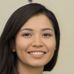 Joyful asian young-adult female with long  brown hair and brown eyes