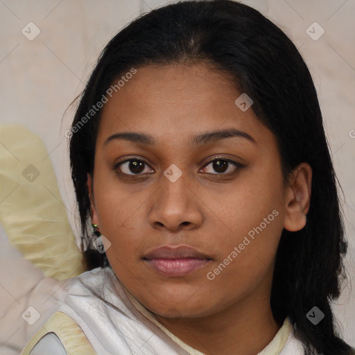 Joyful black young-adult female with medium  brown hair and brown eyes