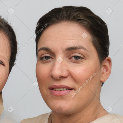 Joyful white adult female with short  brown hair and brown eyes