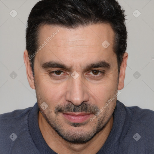 Joyful white adult male with short  black hair and brown eyes